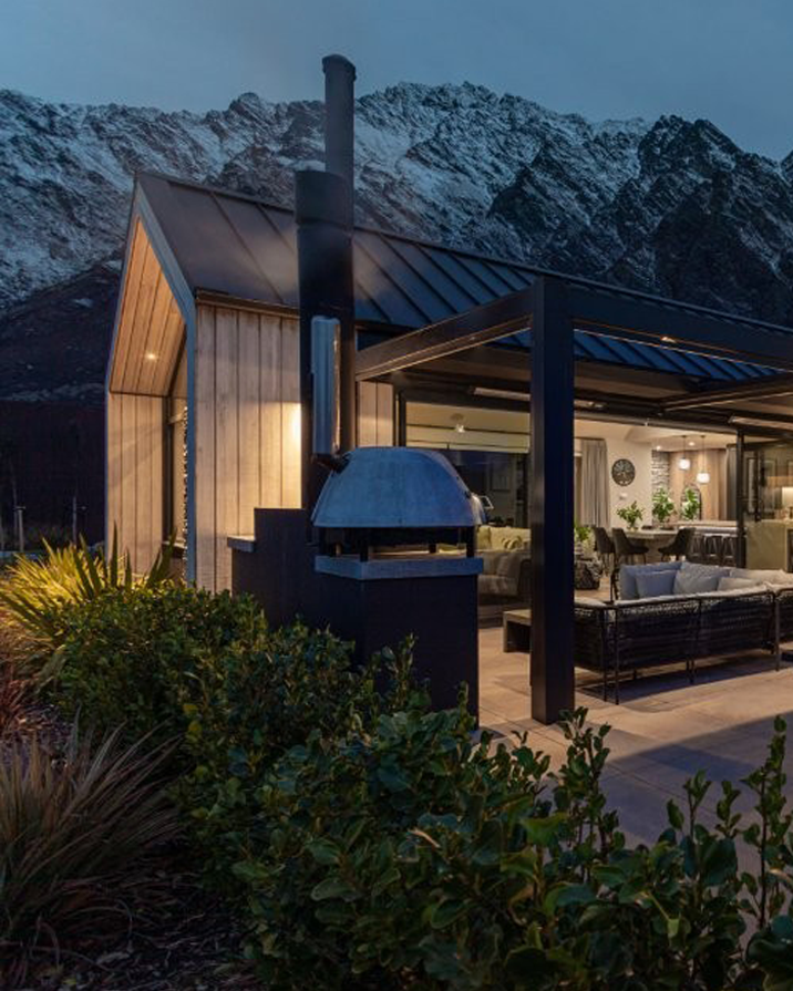 Outdoor Fireplace - night time - built in kiitchen