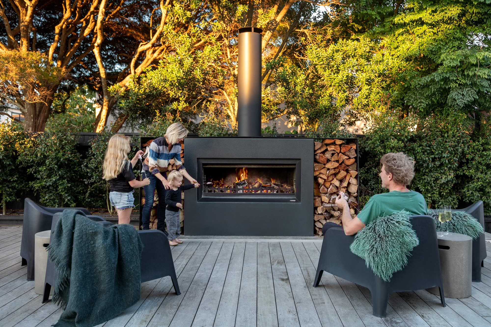 Family around Burton fireplace 