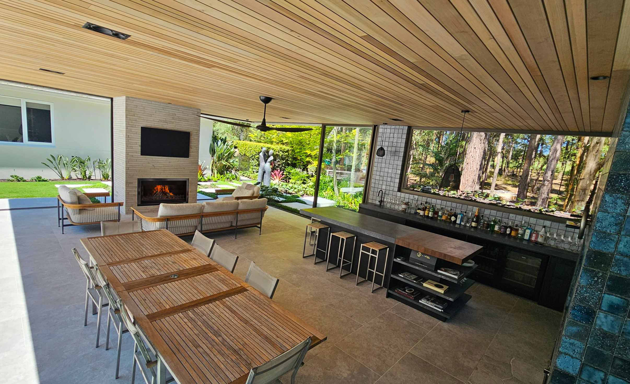 Custom outdoor kitchen designed by Rolling Stone Landscapes, featuring a T1200 firebox insert.&nbsp;