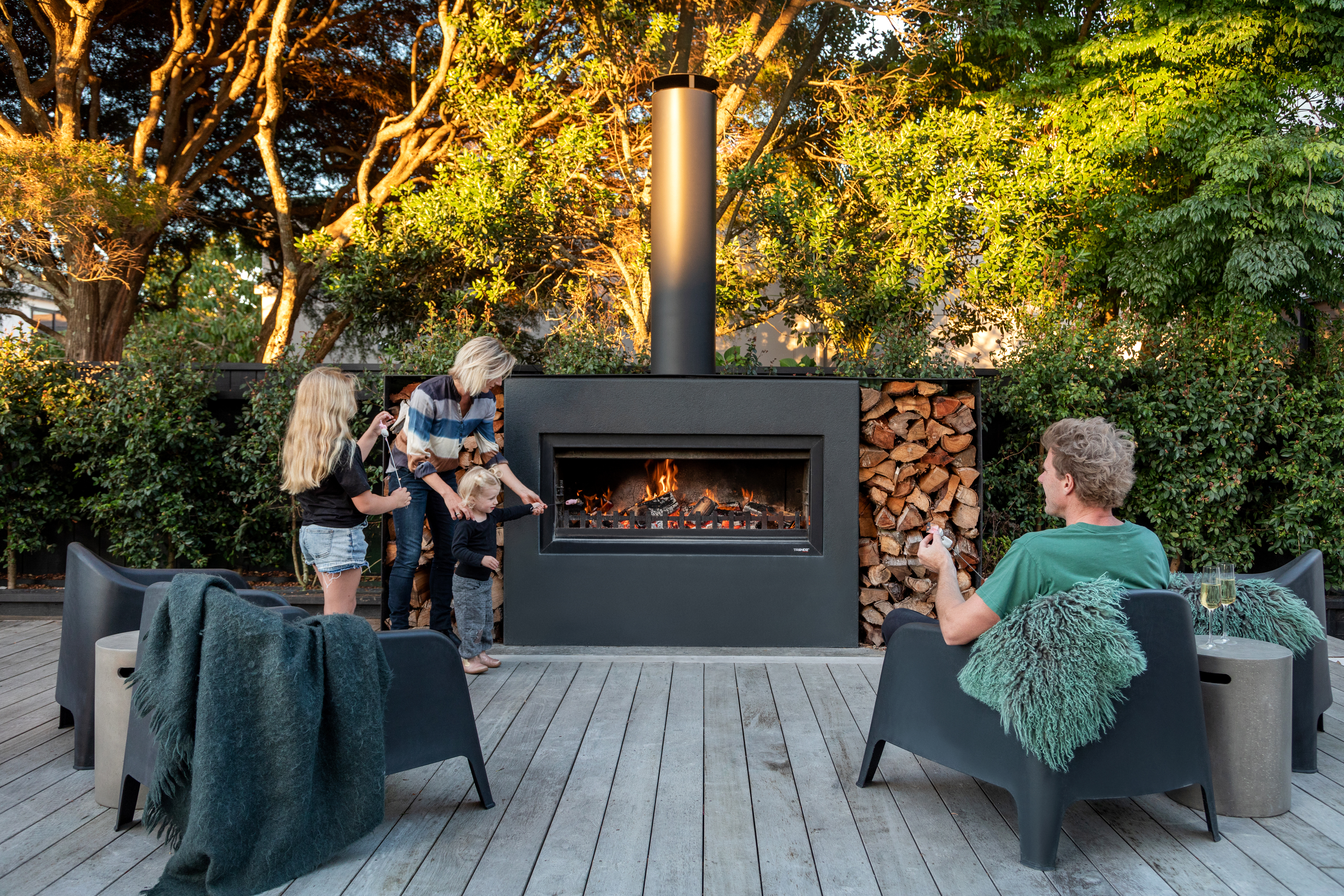 Family around Burton fireplace